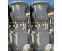 Pair of Carrara white marble fluted urns with plinths and Faun head handles