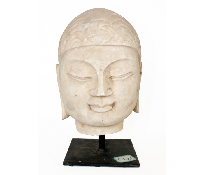Golden hand carved marble Buddha head