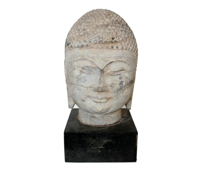 Aged white marble Buddha head sculpture