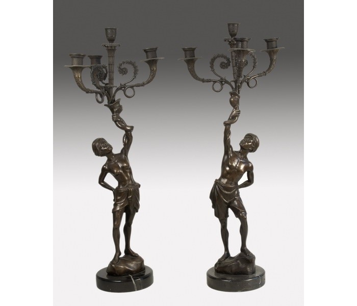 Pair of bronze torchiere holding...