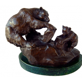 Bronze mother bear with cub...