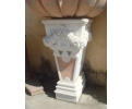 White Carrara marble wall pedestal plinth with rossetta marble panel inlay, garlands and decorative reliefs