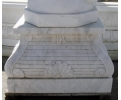 White veined Carrara marble plinth base with relier plant decorations