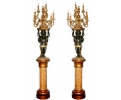 Pair of faux gilt bronze resin angel torchierers holding candelabra