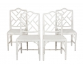 Cuatro sillas lacadas en blanco simulando bambú años 80
