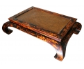 Chinese black lacquered coffee table with woven rattan top and curved legs
