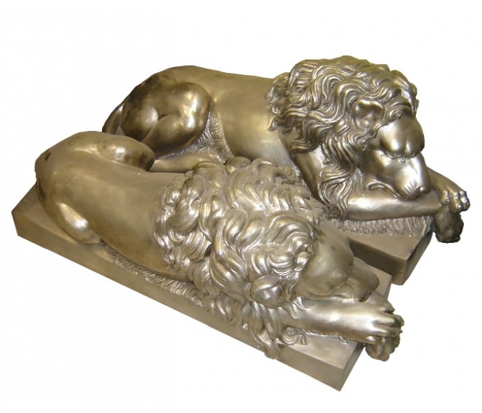 Pair of silvered bronze lying lions...