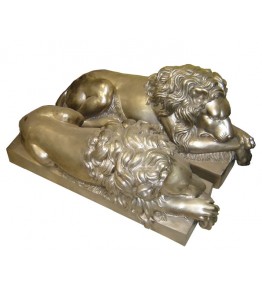 Pair of silvered bronze lying lions statues