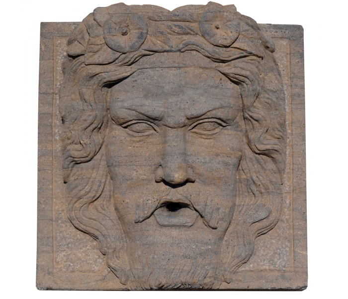 Mascarón de piedra envejecida
