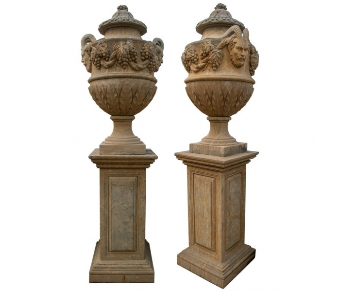 Pair of hand carved marble urns on...