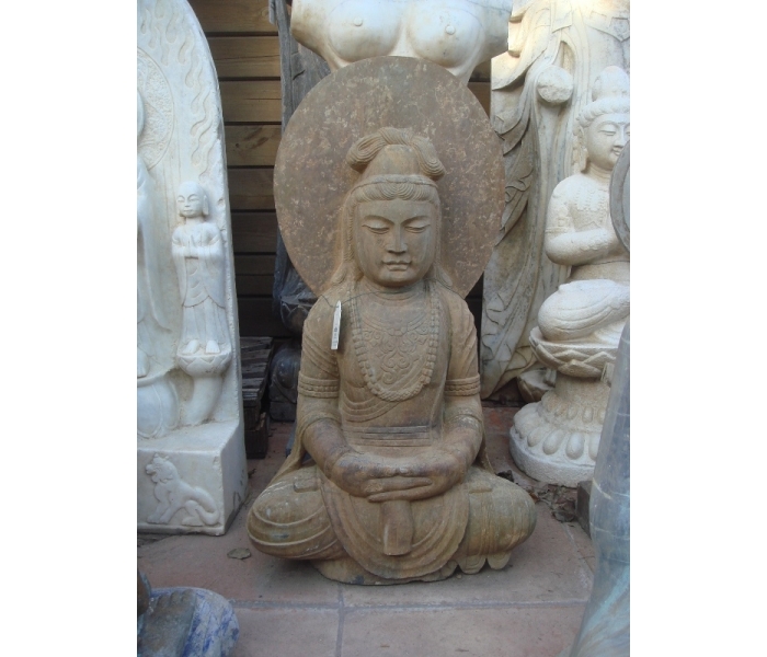 Aged black marble stitting Buddha...