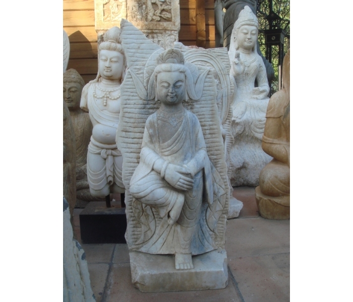 Aged white marble standing Buddha...