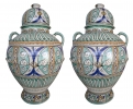 Pair of painted glazed ceramic urns with lids
