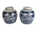 Pair of Chinese white and cobalt blue glazed pocelain urns with lid