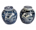 Pair of Chinese white and cobalt blue glazed pocelain urns with lid
