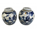 Pair of Chinese white and cobalt blue glazed pocelain urns with lid