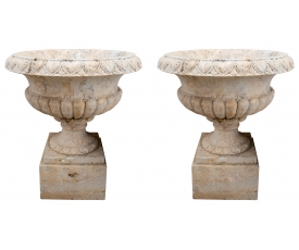 Pair of Romano travertine garden fluted urns with plinths