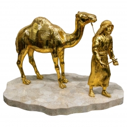 Escultura de bronce dorado...