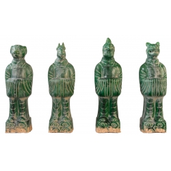 Set of four green glazed...