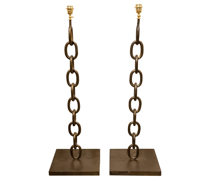 Pair of iron lamps in the shape of a...